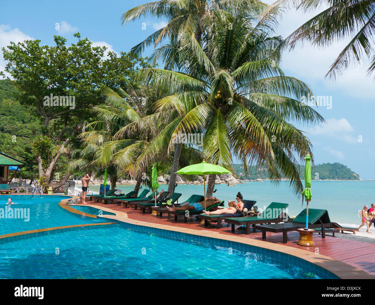 People by the side of a swimming pool on Thong Nai Phan beach in Koh Phangan Thailand Stock Photo