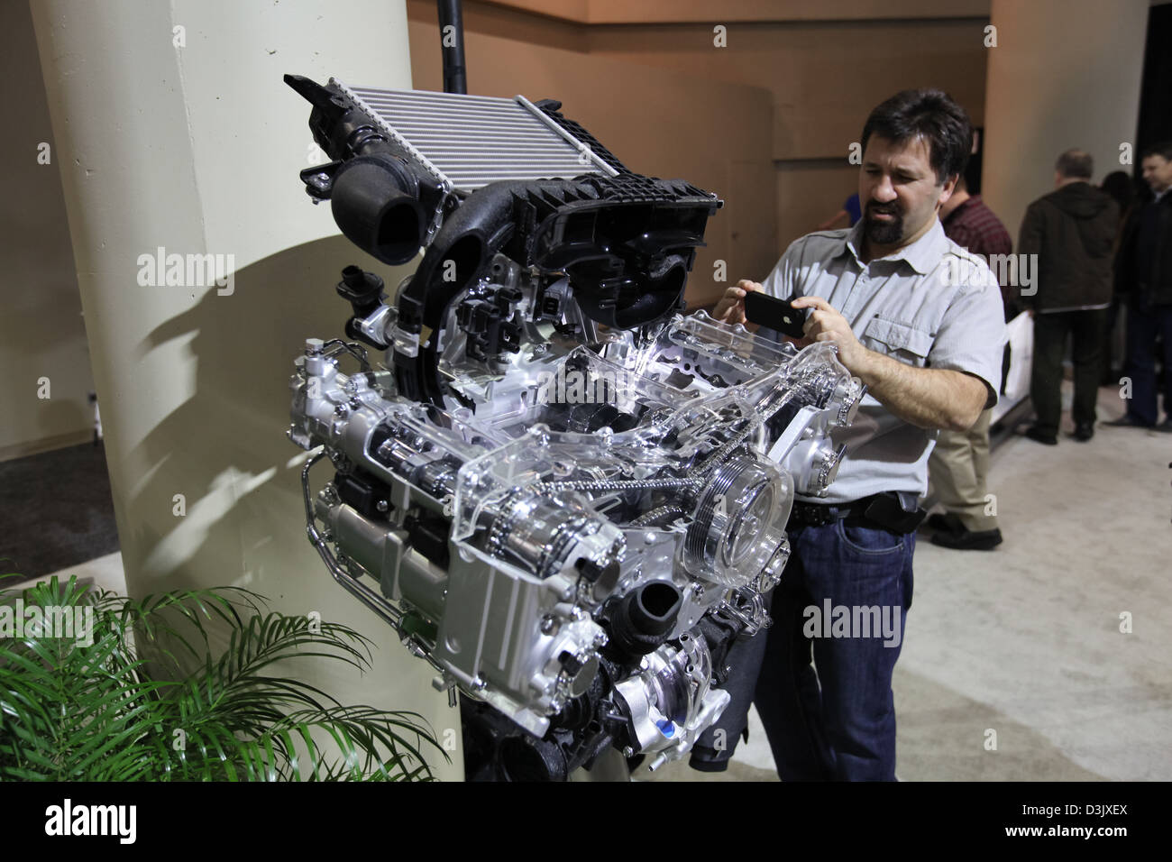 man taking picture car engine Stock Photo