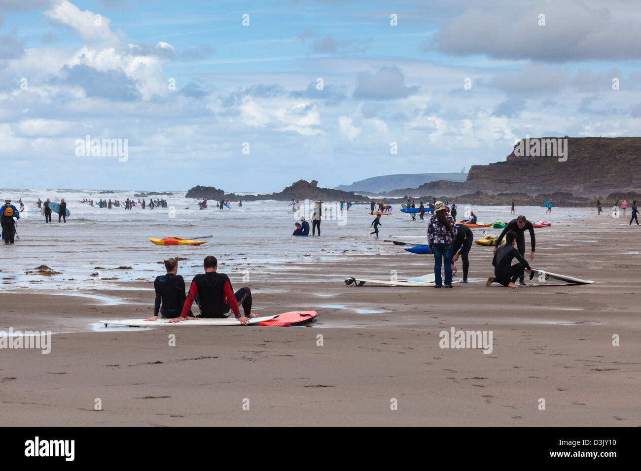 Busy surfing and kayaking beach at Black Rock Sands, Widemouth Bay, nr