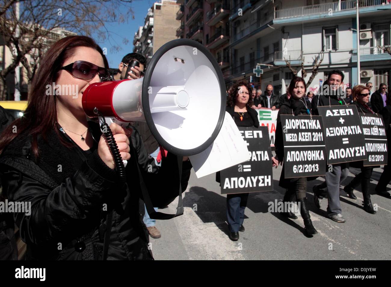 Thessaloniki, Greece. 20th February 2013. A woman calls slogans into a megaphone during a general strike on 20/02/2013 in Thessaloniki, Greece. The strike was called by the trade union confederations of GSEE and ADEDY. Protesters were demonstrating against the austerity measures in Greece which has seen taxes increased and wages, pensions and public spending cut.  Credit:  Art of Focus / Alamy Live News Stock Photo