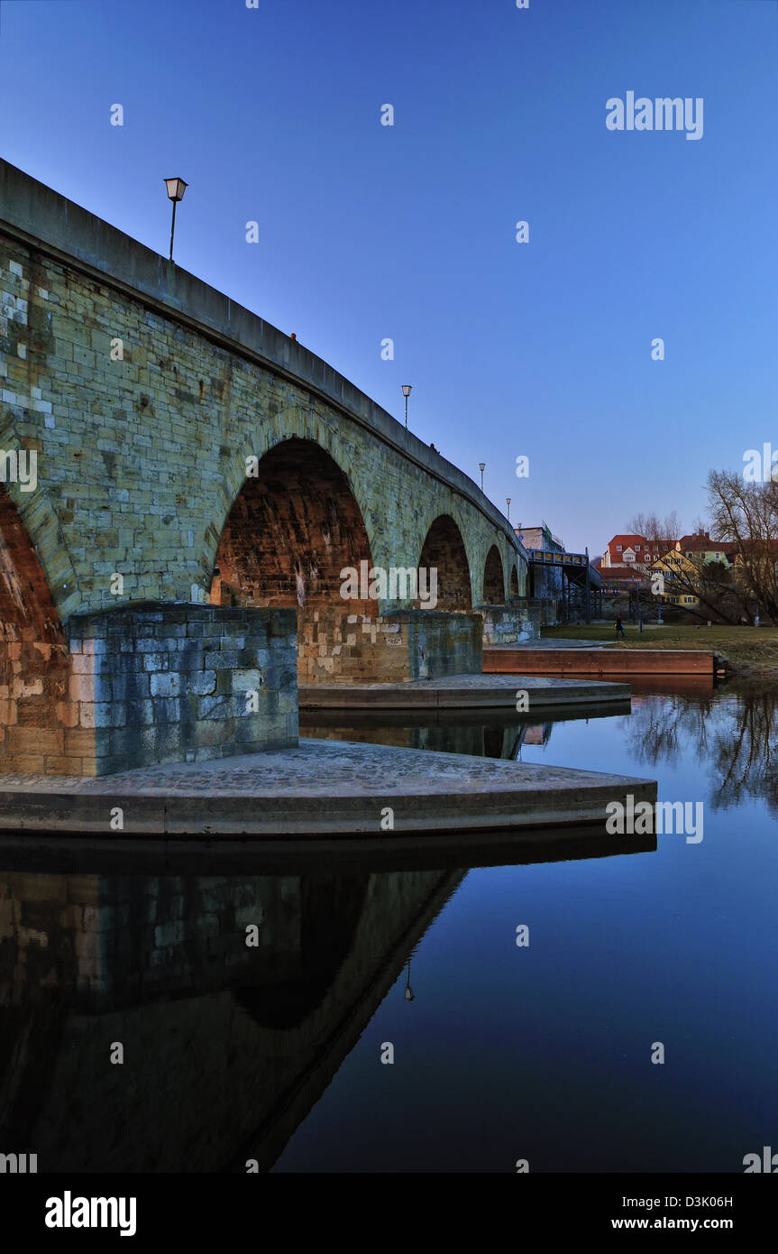 The old Stone Bridge and Brücktor city gate in Regensburg, Bavaria, Germany spanning the Danube River. Stock Photo