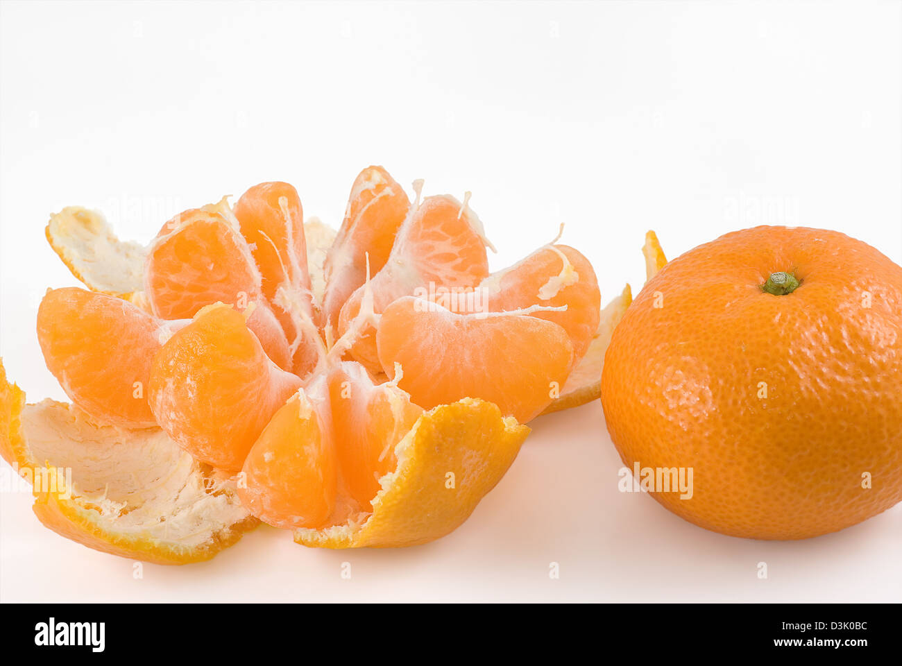 Two tangerines are photographed on a white background Stock Photo