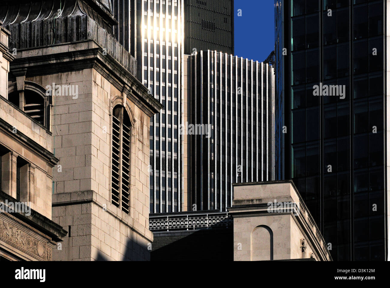 London, England, UK. Old church and modern office blocks in the City of London Stock Photo