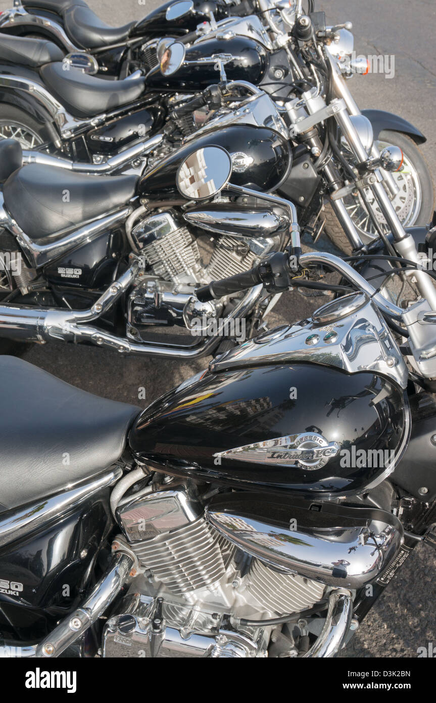 Row or line of black and chromium plated motorbikes Stock Photo