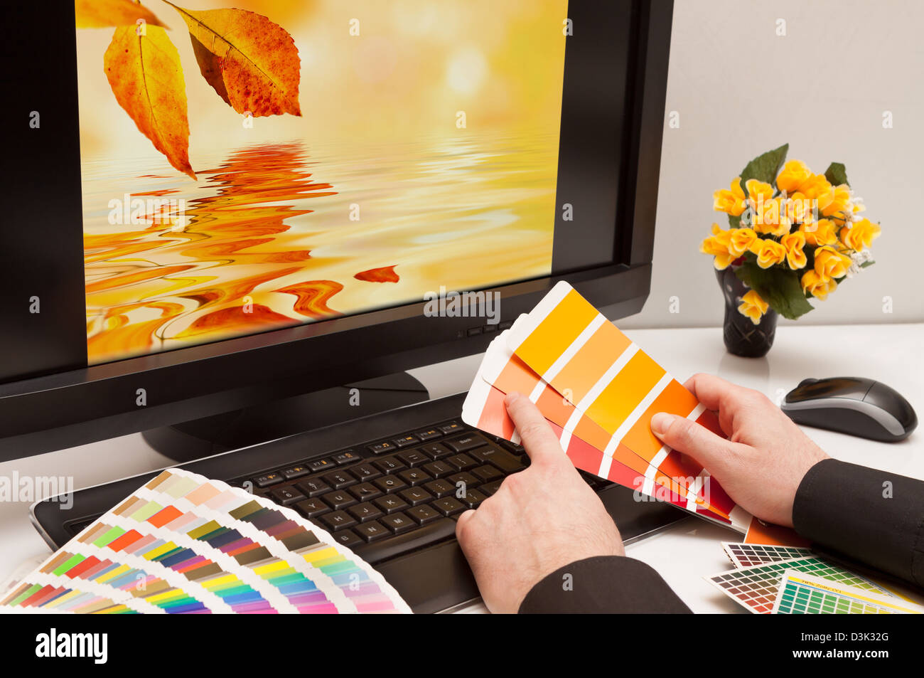 Graphic designer at work. Color samples. Brown, yellow images Stock Photo