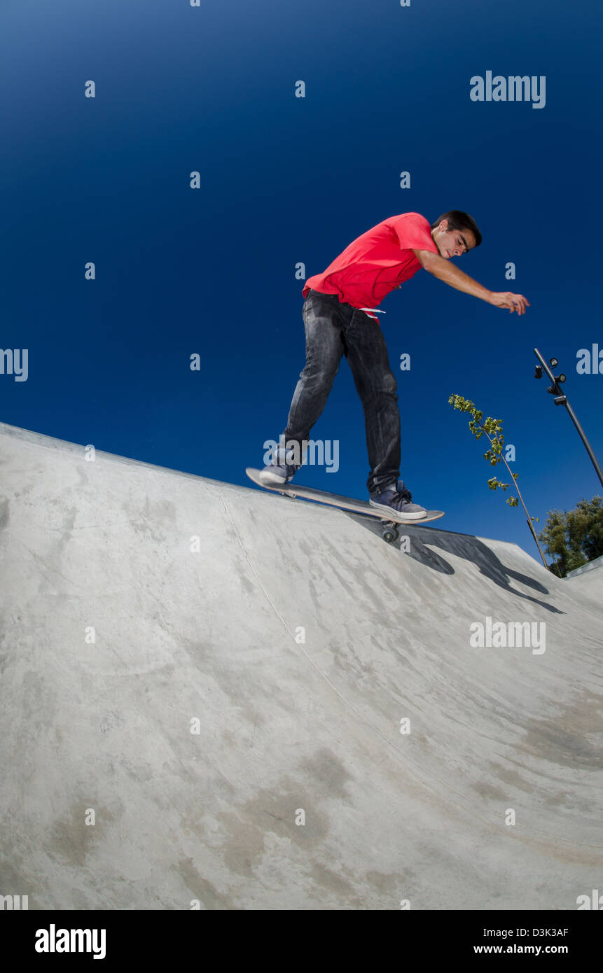 Skateboarder doing a bs disaster on a curb Stock Photo - Alamy