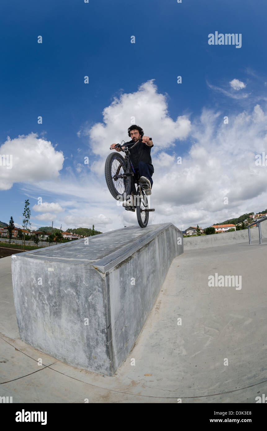 Bmx rider on a ramp over cloudy sky background Stock Photo - Alamy