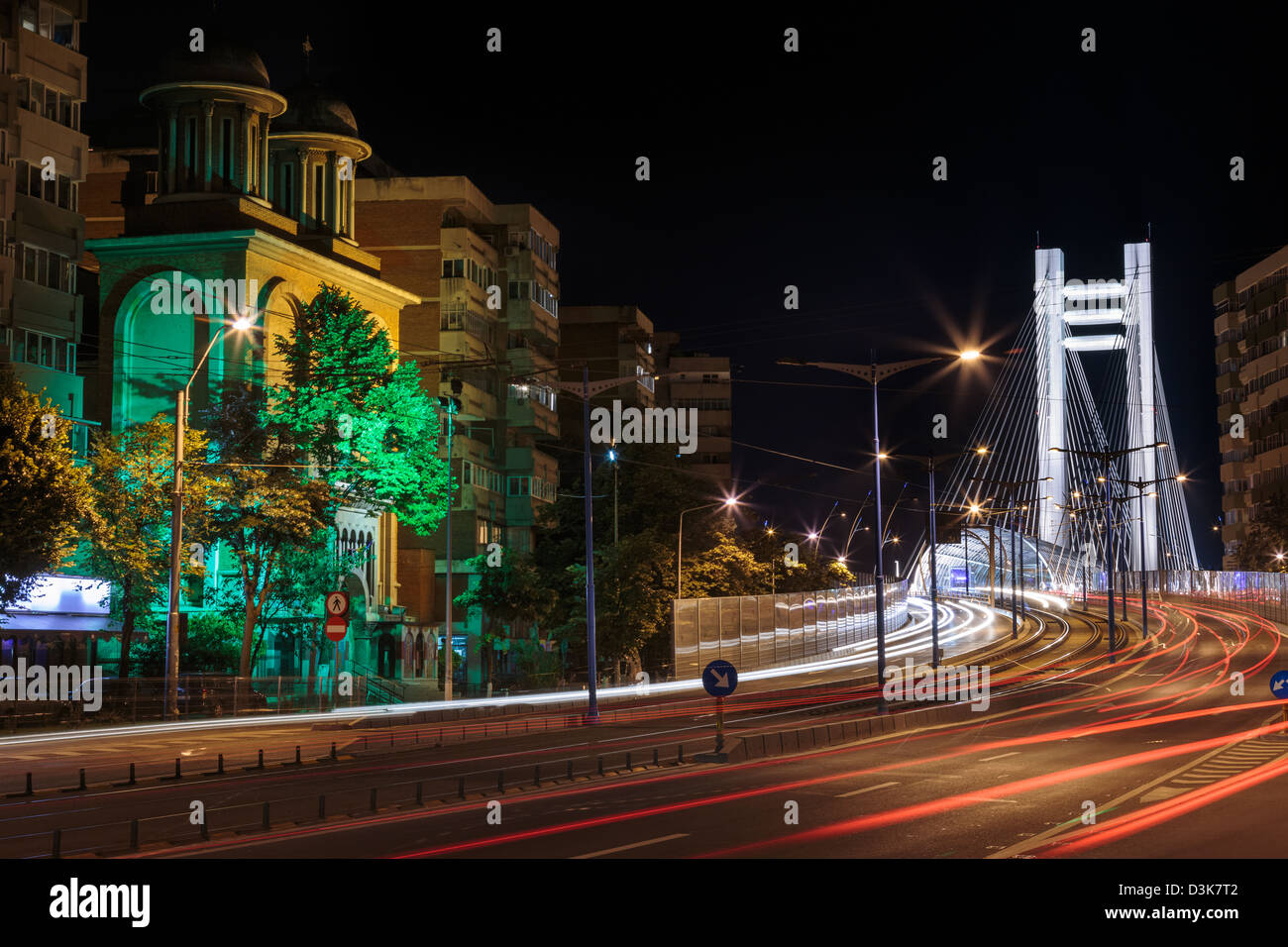 Urban night view with tramway and Basarab Bridge in the distance in Bucharest, Romania. Stock Photo