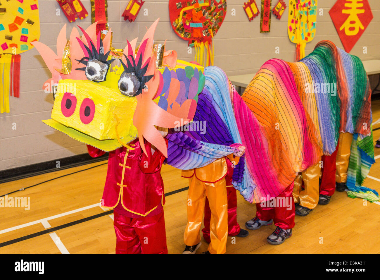 Children performing as Chinese lion at chinese new year celebration. Stock Photo
