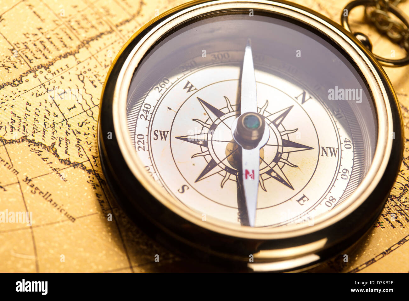 Compass on the old map background Stock Photo - Alamy