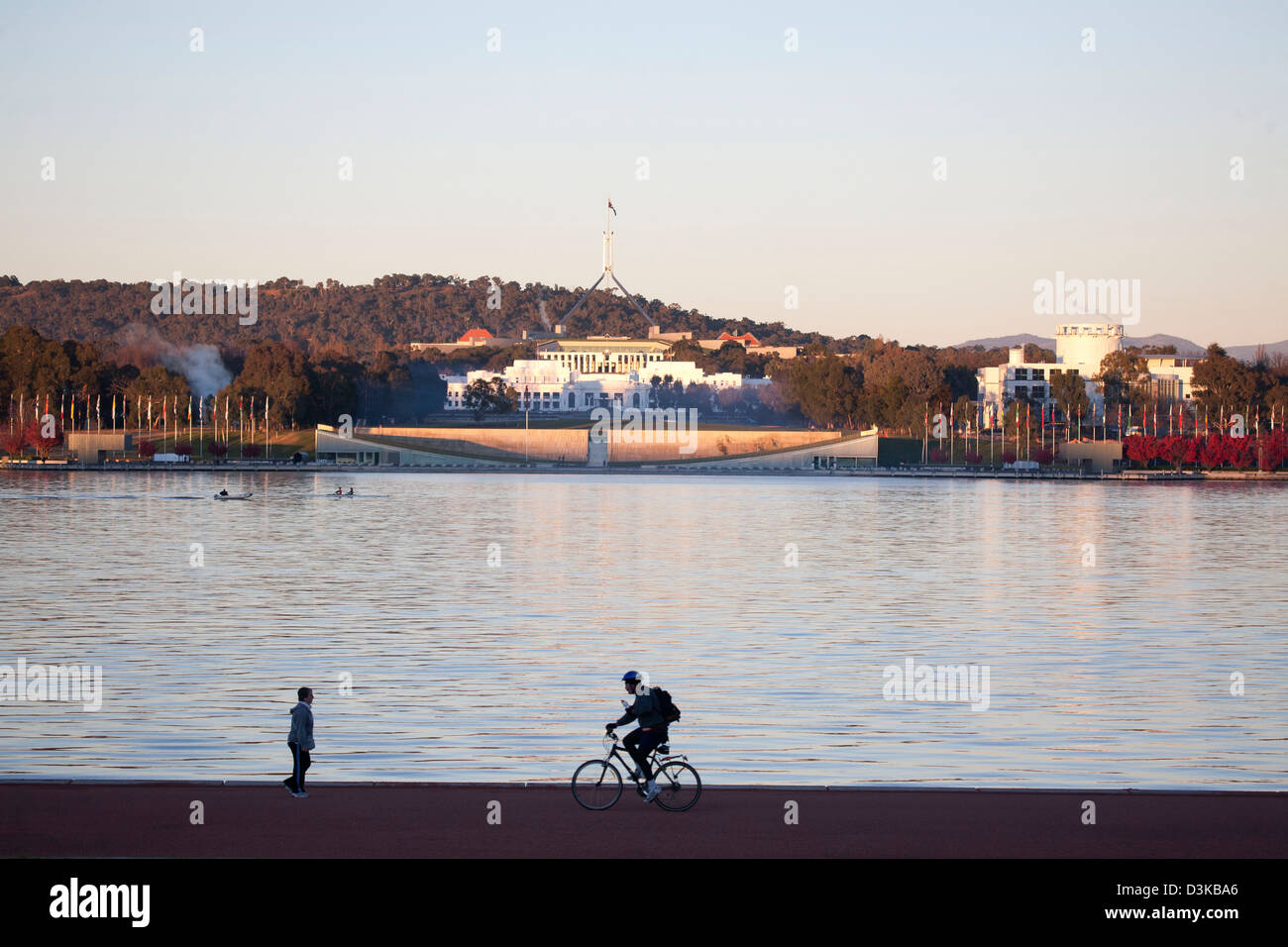 Walking and cycling around Lake Burley Griffin at sunrise Canberra Australia Stock Photo