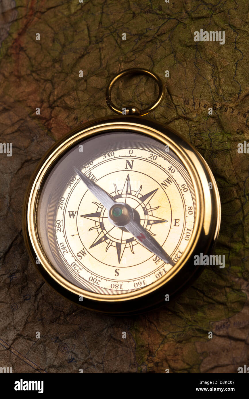 Compass on the old map background Stock Photo - Alamy