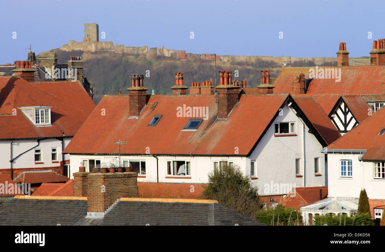 Red tiled houses and Scarborough Castle, North Yorkshire, England. Stock Photo