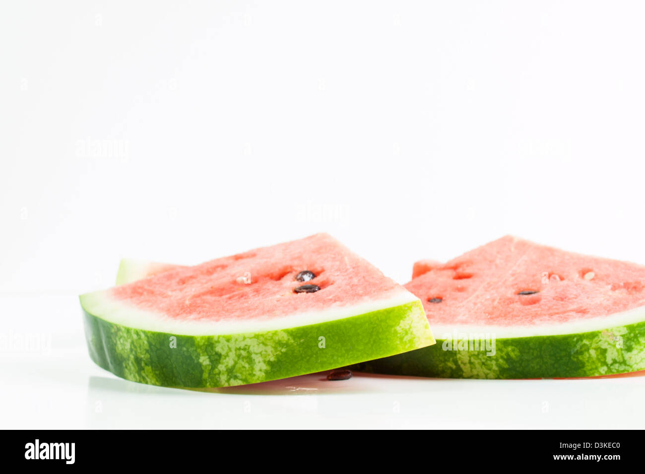 Fresh slices of watermelon on white background Stock Photo - Alamy