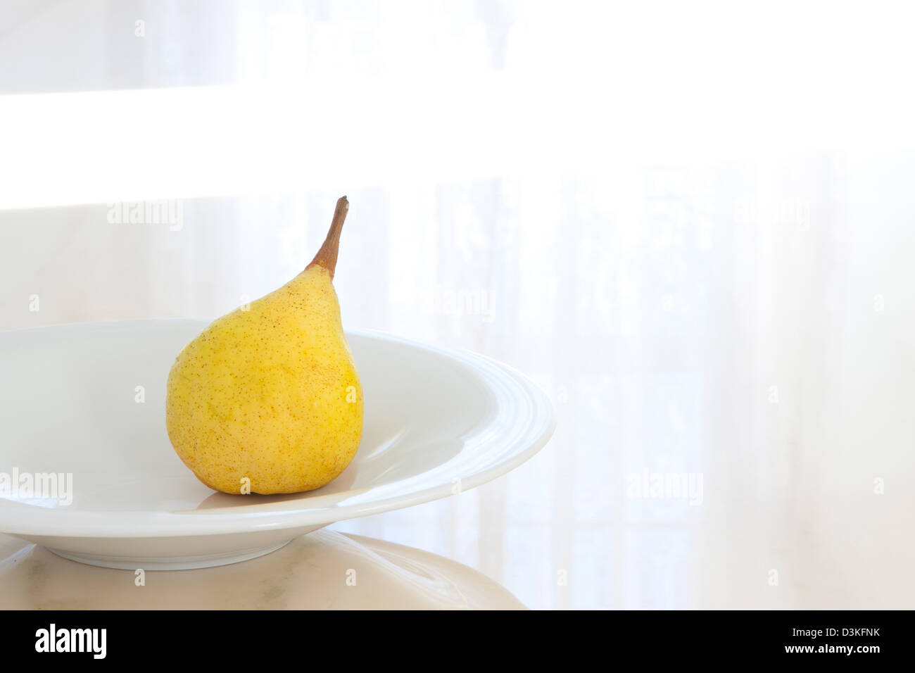 Pear on a plate Stock Photo