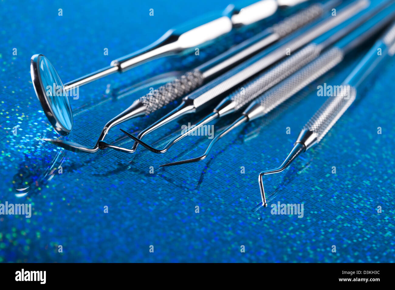 Dentist equipment on blue background Stock Photo Alamy