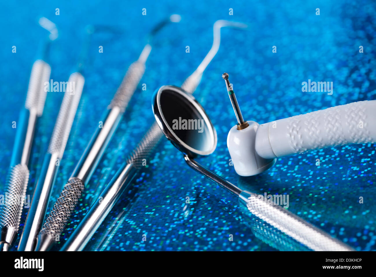 Dentist equipment on blue background Stock Photo Alamy