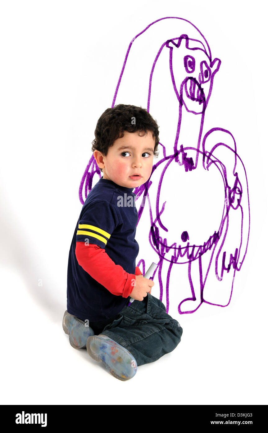 Young artistic boy doing wall painting Stock Photo