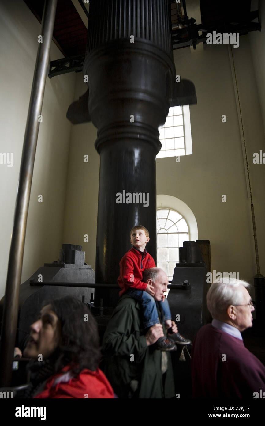 Visitors / tourists & the Ninety Inch Cornish Beam engine (originally 'The Grand Junction Engine'). Brentford Steam museum. UK Stock Photo