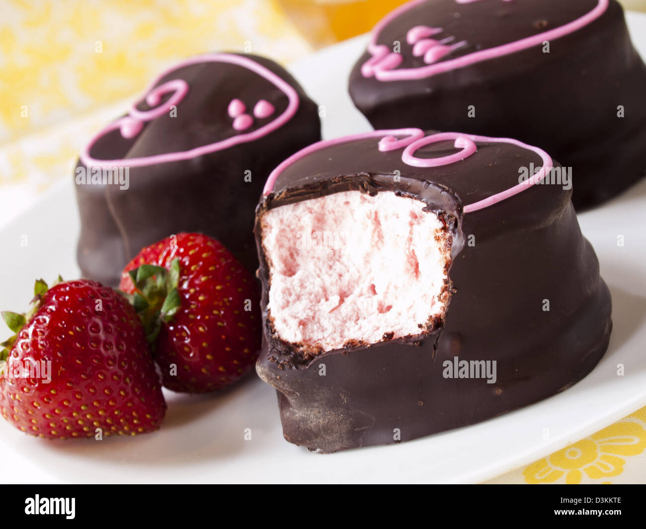 Gourmet chocolate covered strawberry marshmallows on white background ...