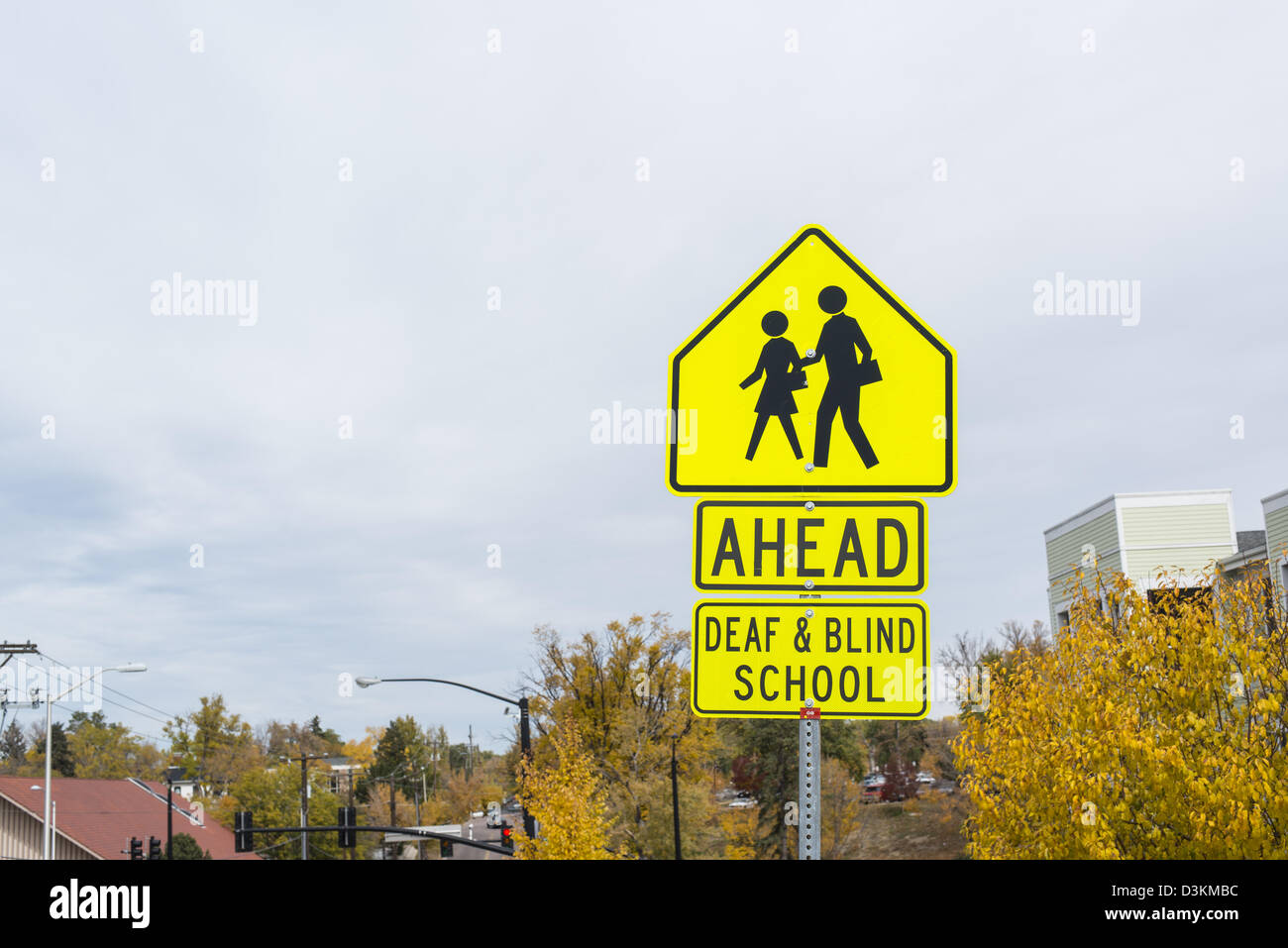 Traffic sign warning for a deaf and blind school ahead Stock Photo