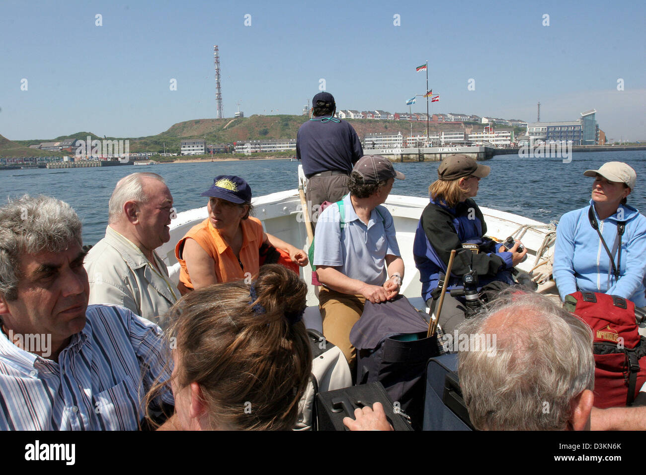 (dpa) - The picture dated 24 June 2005 shows tourists being disembarked offshore Helgoland, Germany. Photo: Uwe Zucchi Stock Photo