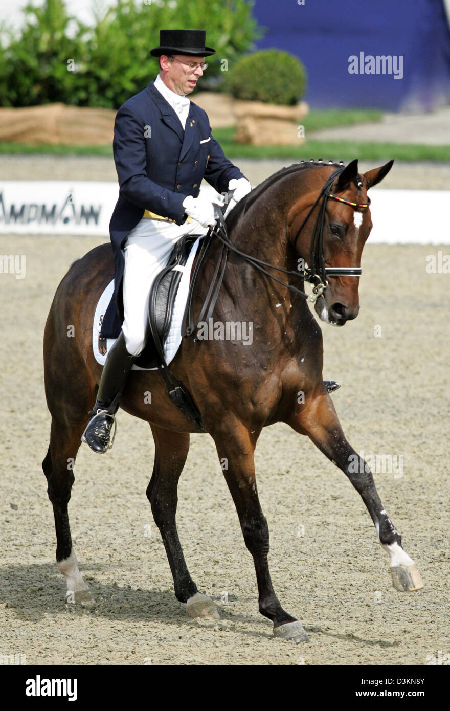 (dpa) - German dressage horseman Klaus Husenbeth pictured at his single tryout with his horse 'Piccolino' at the Dressage European Championships in Hagen, Germany, Saturday 30 July 2005. The Dressage European Championships will last until Sunday 31 July 2005.. Photo: Friso Gentsch Stock Photo