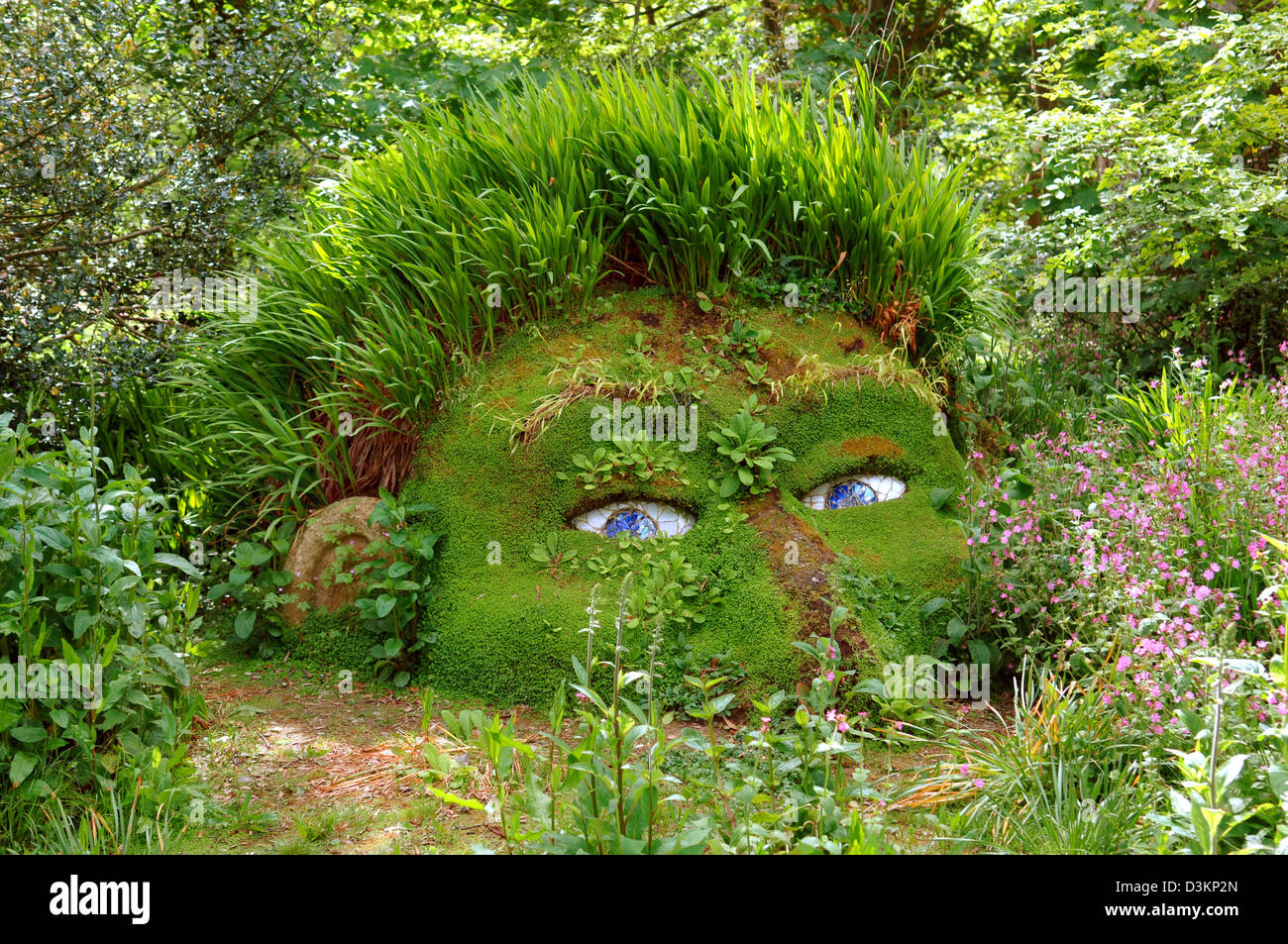 (dpa) - The picture shows the so-called Giant Head in 'The lost Gardens of Heligan' in Pentawan close to St. Austell, England, 29 May 2005. The garden sculpture was planted on a tree root. The garden is part of a manor and was a 'Sleeping Beauty' since it was forgotten for 75 years and only discovered in 1990. After extensive works the garden was opened for public in 1992. Photo: F Stock Photo