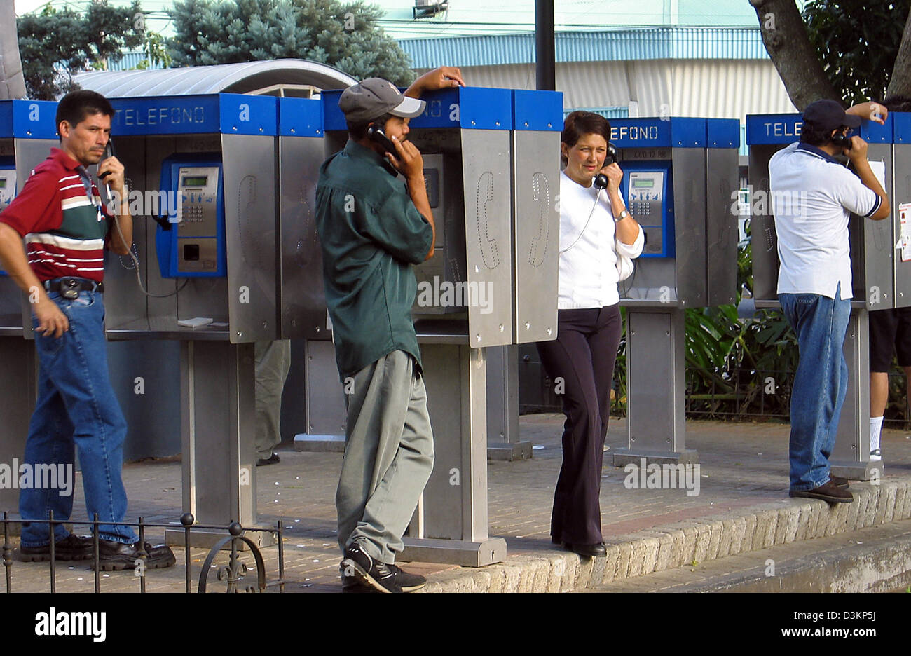(dpa) - The picture shows Costa Ricans speaking using public telephones at Plaza Central in Alajuela, Costa Rica, 4 March 2005. Photo: Rolf Haid Stock Photo