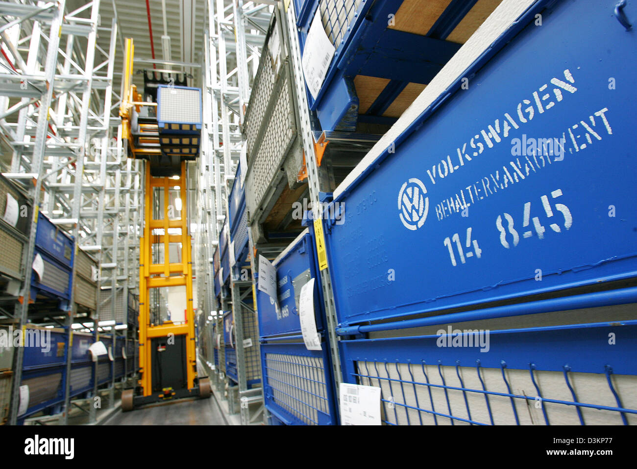 dpa) - A forklift driver places boxes with car parts in the high racks in  the Original Parts Centre (OTC) of Volkswagen (VW) in Baunatal, Germany, 4  August 2005. The OTC completed