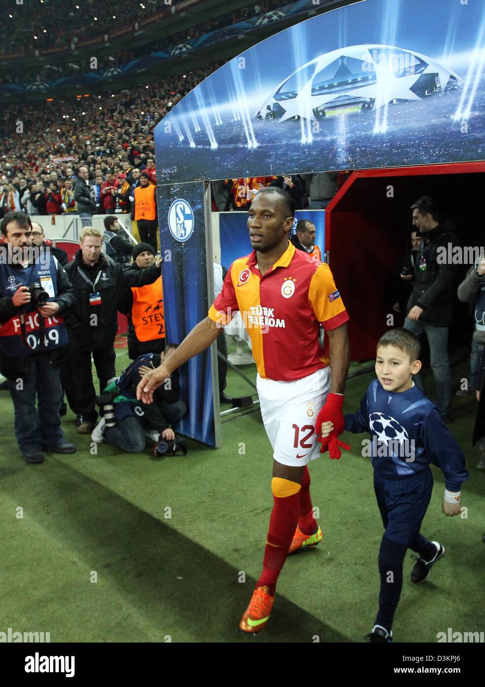 Galatasaray's Didier Drogba enters the pitch prior to the UEFA Champions League round of 16 first leg soccer match between Galatasaray Istanbul and FC Schalke 04 at Ali Sami Yen Spor Kompleksi stadium in Istanbul, Turkey, 20 February 2013. Photo: Friso Gentsch/dpa Stock Photo