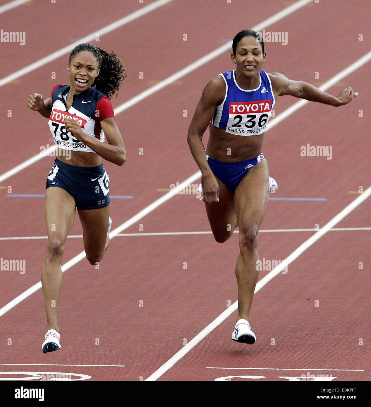 (dpa) - US athlete Allyson Felix crosses the finishing line and wins the women's 200m final ahead of French athlete Christine Arron at the 10th IAAF World Championships in Helsinki, Finland, Friday 12 August 2005. Felix won won gold and Arron took bronze. Photo: Kerim Okten Stock Photo