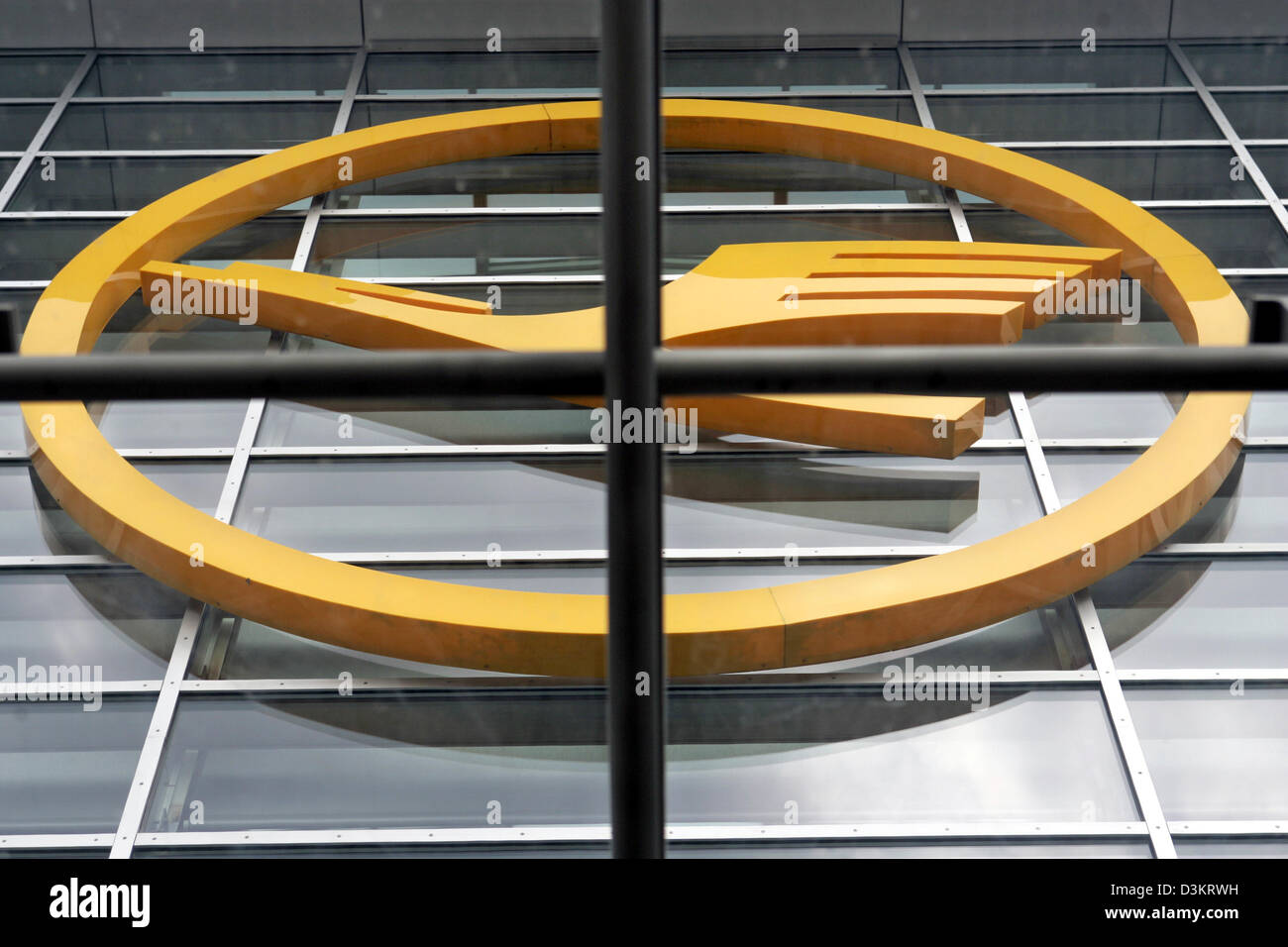 (dpa) - The Lufthansa logo, taken through the crossbars of a window , is pictured on the facade of a building at the airport in Frankfurt Main, Germany, 23 August 2005. Photo:Frank May Stock Photo