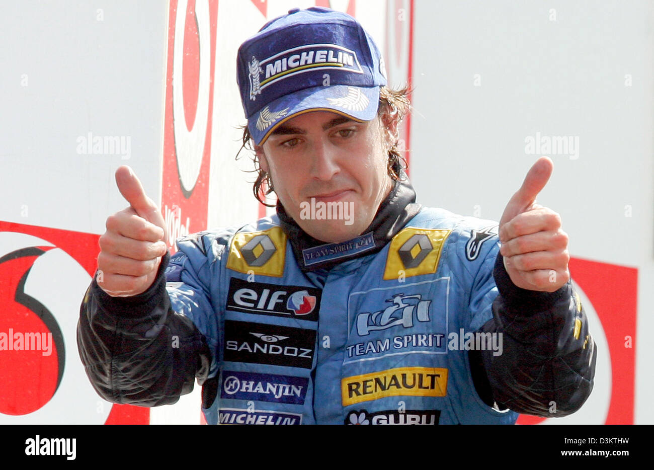 Spanish Formula One driver Fernando Alonso (Renault) reacts on the podium after the Grand Prix of Italy at the Italian Grand Prix track in Monza, Italy, Sunday 04 September 2005. Alonso came in second after Columbian Juan Pablo Montoya of McLaren Mercedes who won ahead of Fernando Alonso and Giancarlo Fisichella (both Renault). Stock Photo