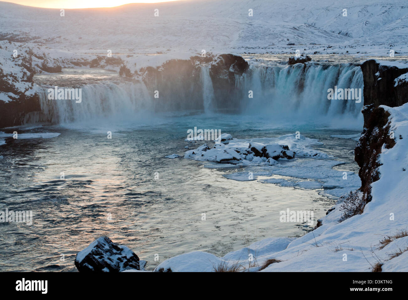 Waterfall in Iceland at sunset Stock Photo