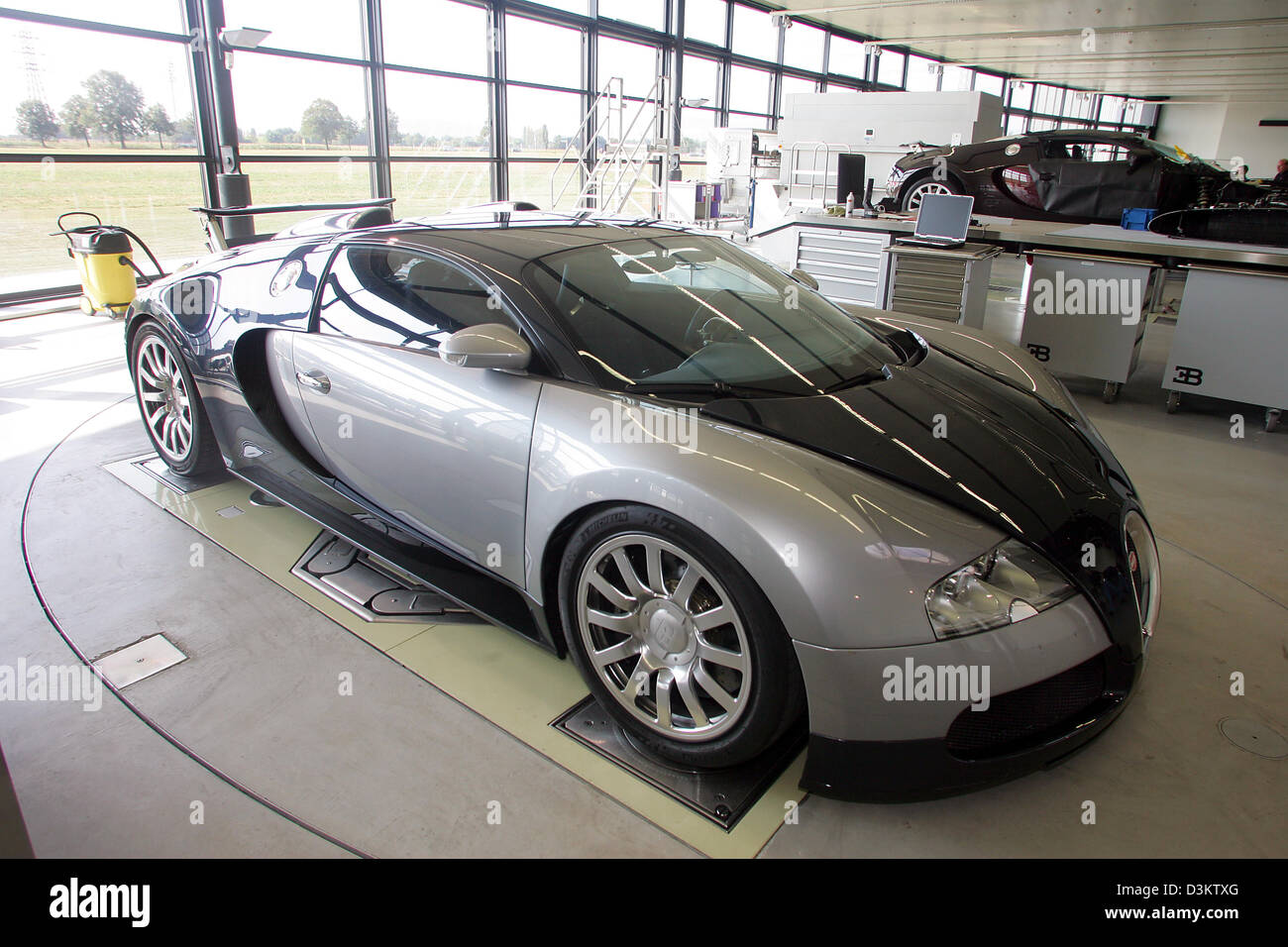 (dpa) - The new Bugatti EB Veyron 16.4 pictured in the factory of the car manufaturer in Molsheim, France, Thursday 8 September 2005. After several delays the Volkswagen daughter Bugatti Automobiles SAS releases the most expensive and fastest car permitted for the road traffic. In the following year a maximum of 300 exemplars of 1001 HP strong and 407 km/h fast race car shall be so Stock Photo