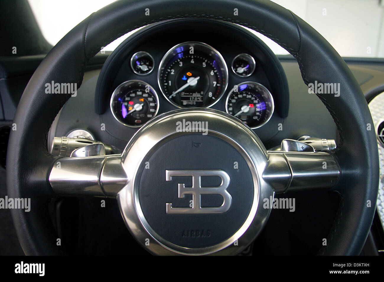 (dpa) - The cockpit of the new Bugatti EB Veyron 16.4 pictured in the factory of the car manufacturer in Molsheim, France, Thursday 8 September 2005. It features even a display for the used HP (bottom left). After several delays the Volkswagen daughter Bugatti Automobiles SAS releases the most expensive and fastest car permitted for the road traffic. In the following year a maximum Stock Photo