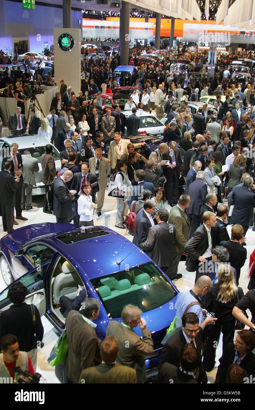 dpa) - Groups of visitors look at the Skoda Roomster at the stand of Skoda  during the IAA international car show in Frankfurt Main, Germany, 9  September 2003. This prototype of a