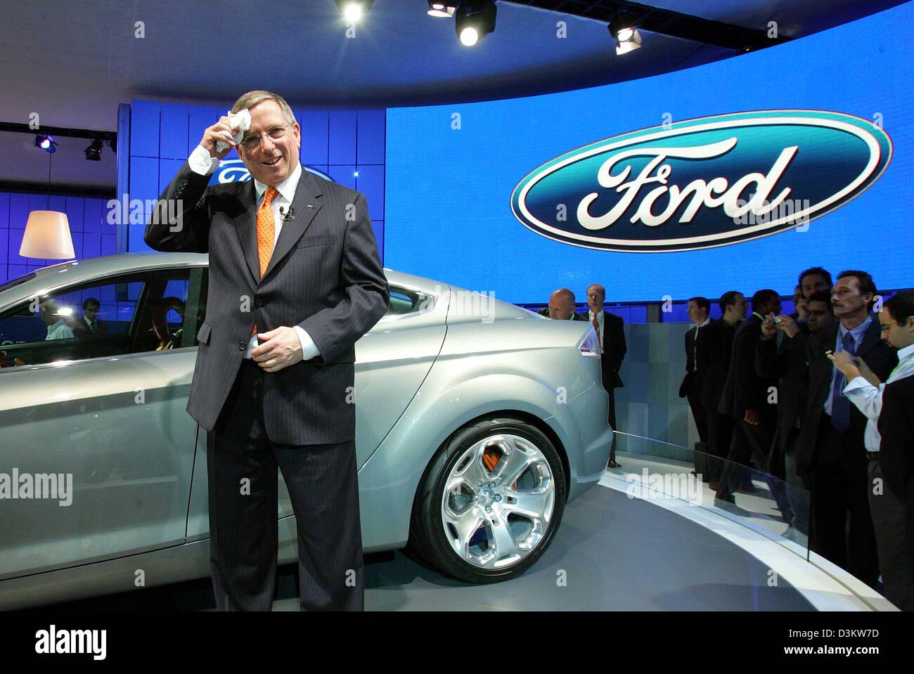 (dpa) - Lewis Booth, Head of Ford's European division wipes his forehead during the presentnation of Ford's new coupe concept study 'Iosis'  during the 61st International Motor Show (IAA) in Frankfurt Main, Germany, Tuesday, 13 September 2005. The IAA continues until 25 September and organisers expect around one million visitors. Almost 1,000 exhibitors from 44 countries present th Stock Photo
