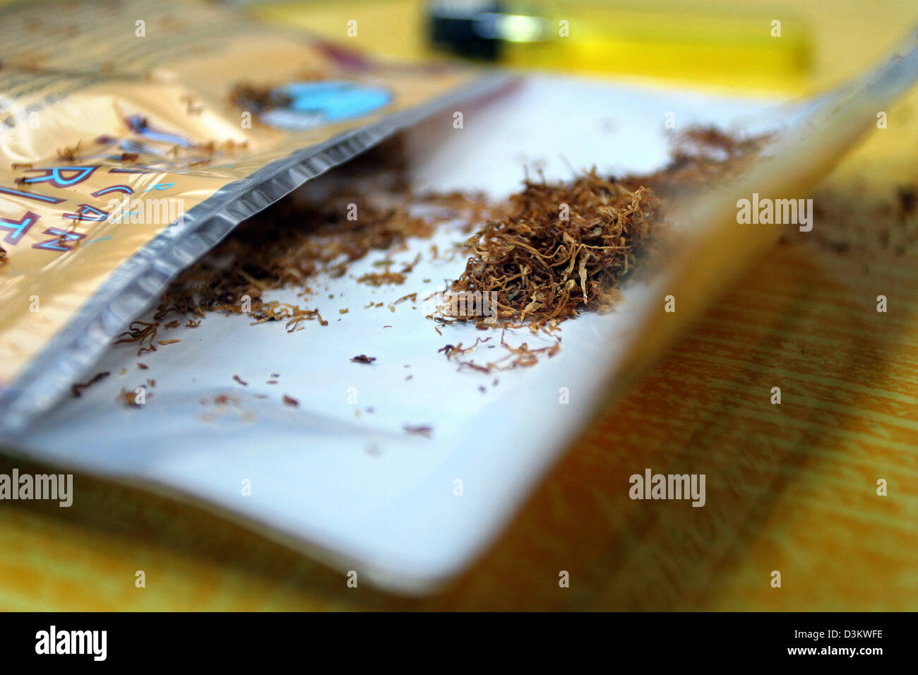 how much is rolling tobacco in germany dpa) - The picture dated 16 August 2005 shows a package of tobacco in  Frankfurt, Germany. Rolling cigarettes is cheaper than buying packets.  Photo: Heiko Wolfraum Stock Photo