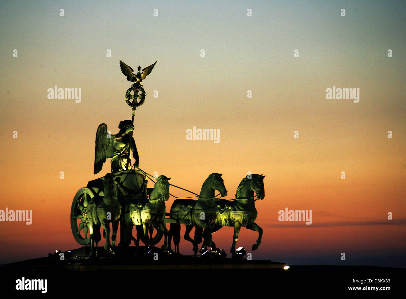 (dpa) - The picture shows the Quadriga statue on top of Brandenburg Gate during sunset in Berlin, Germany, Tuesday 20 September 2005. Brandenburg Gate is Berlin's most significant symbol representing the German union. The Quadriga sculpture was designed by Johann Gottfried Schadow and set up in 1794. Photo: Michael Hanschke Stock Photo
