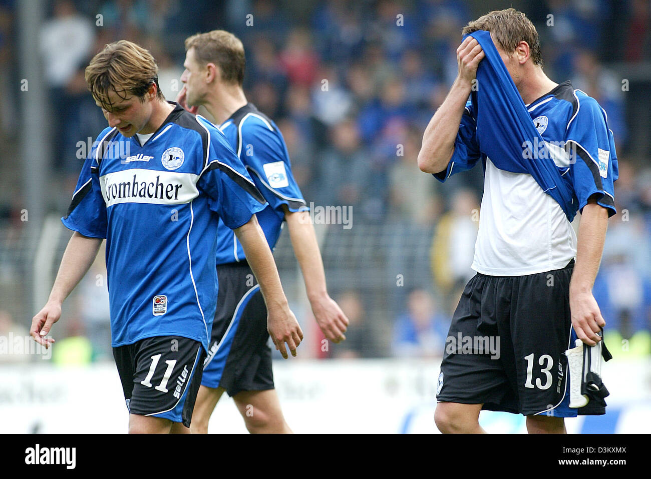 (dpa) - Arminia Bielefeld's David Koblyik (L) and Michael Fink (R) are frustrated after their Bundesliga defeat against Borussia Moenchengladbach at the Schueco Arena stadium in Bielefeld, Germany, 24 September 2005. Photo: Felix Heyder Stock Photo