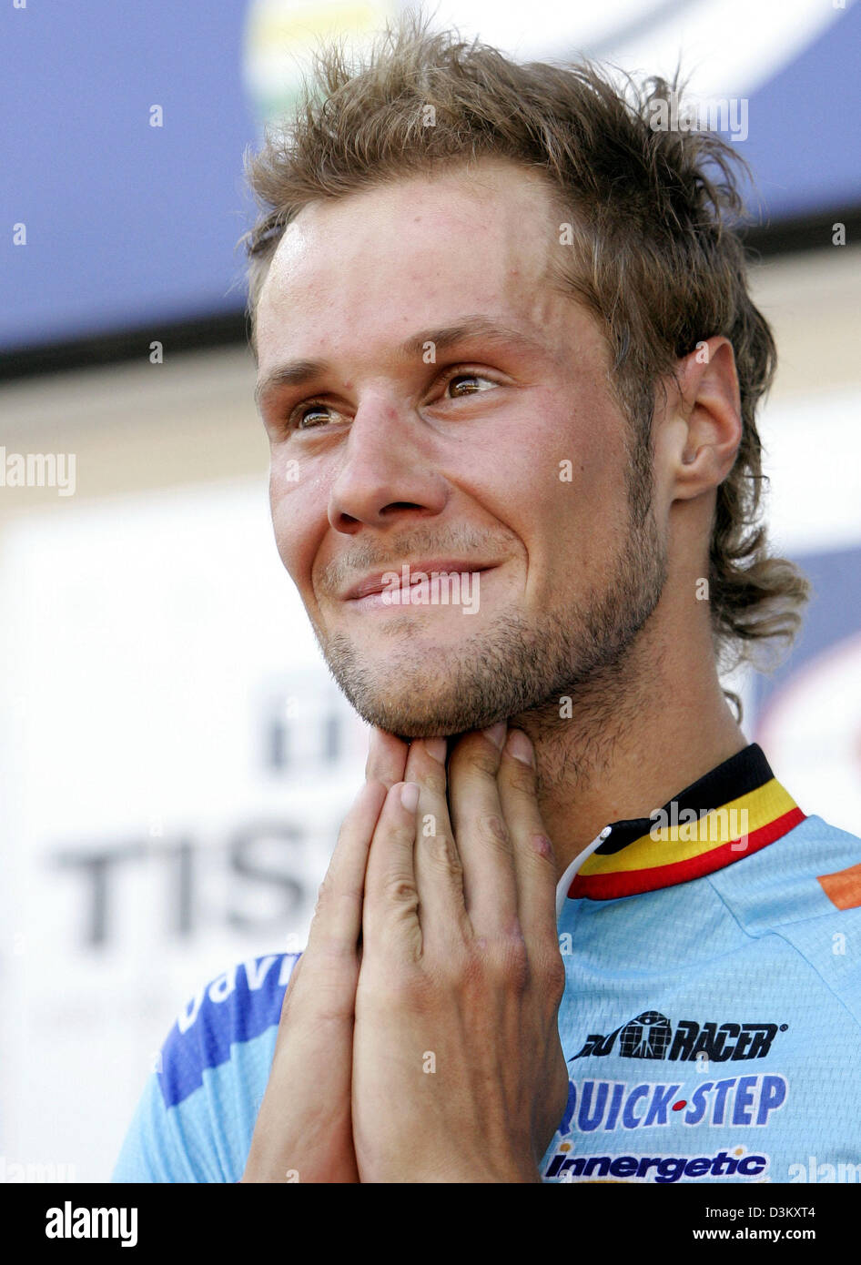 (dpa) - Belgium's cycling pro Tom Boonen (R) smiles after winning the world road race crown in Madrid, Spain, 25 September 2005. As predicted the city centre course produced a cagey race with a bunch sprint over the final few metres of the 273 kilometres course. Photo: Bernd Thissen Stock Photo