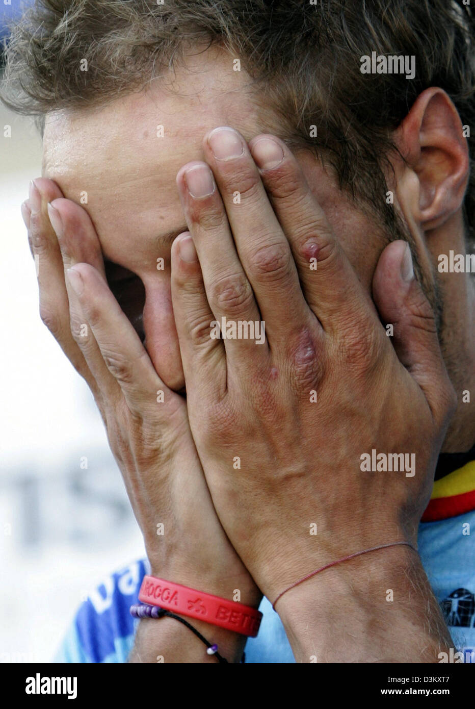 (dpa) - Belgian cycling pro Tom Boonen is overhelmed by his emotions after winning the world road race crown in Madrid, Spain, 25 September 2005. As predicted the city centre course produced a cagey race with a bunch sprint over the final few metres of the 273 kilometres course. Photo: Bernd Thissen Stock Photo