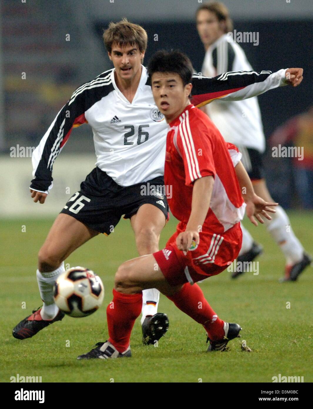 (dpa) - German national soccer player Sebastian Deisler (L) and Chinese player Xiang Sun vie for the ball in the friendly match Germany vs China in the AOL arena in Hamburg, Germany, 12 October 2005. Germany won the match 1-0. Photo: Kay Nietfeld Stock Photo