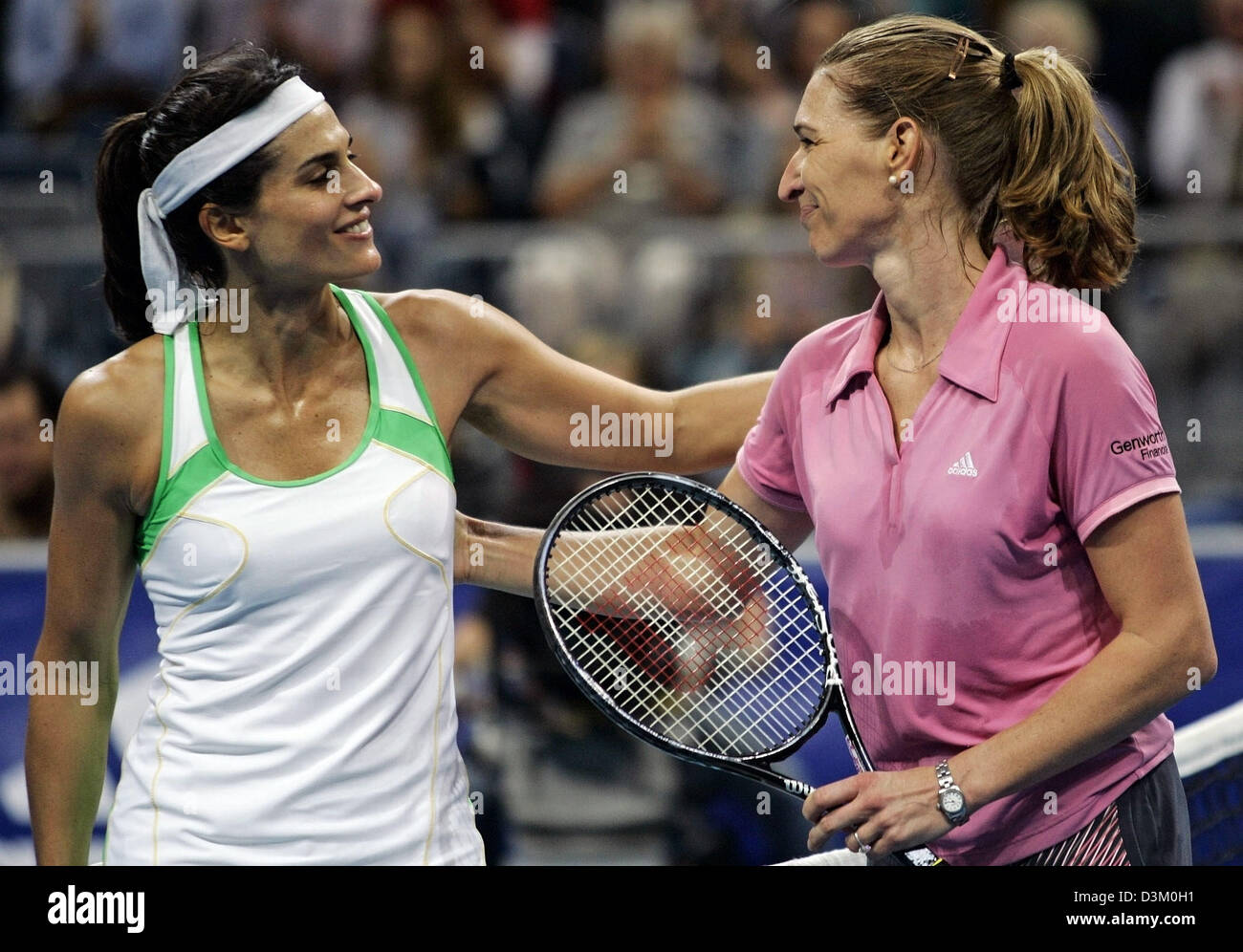 dpa) - Former world class tennis pros German Steffi Graf (L) and  Argentinian Gabriela Sabatini congratulate eacch other after the exhibition  match in the SAP-Arena in Mannheim, Germany, Saturday 15 October 2005.