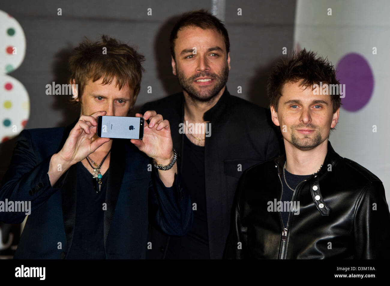 Dominic Howard (l-r), Chris Wolstenholme and Matthew Bellamy of British rockband Muse arrive at the Brit Awards 2013 at O2 Arena in London, England, on 20 February 2013. Photo: Hubert Boesl Stock Photo