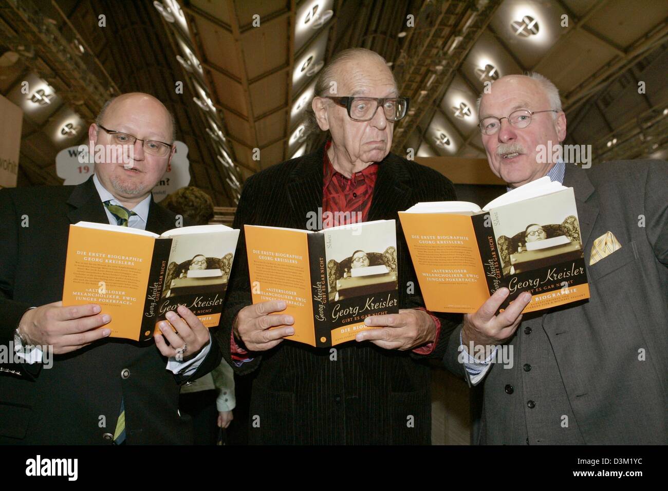 (dpa) - Together with Austrian satirist, chanson singer and cabaret artist Georg Kreisler (C) the authors Hans-Juergen Fink (L) and Michael Seufert (R) present the biography 'Georg Kreisler does not exist' at the Frankfurt Book Fair in Frankfurt, Germany, 20 October 2005. Photo: Frank May Stock Photo