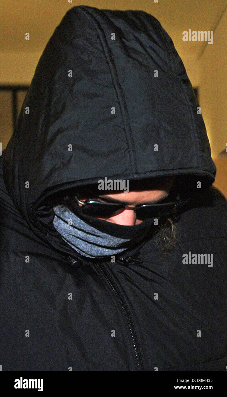 (dpa) - Defendant Claudia G. appears with her head disguised at district court in Regensburg, Germany, Thursday 10 November 2005. School teacher Claudia G. is accused of having sexually abused a 13-years-old pupil. According to police the alcoholised boy was abused outside of the school area. Right after accusations became puclic school authority in Schwandorf suspended her from fu Stock Photo