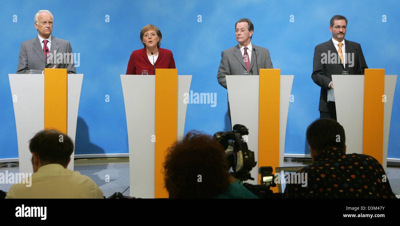 (dpa) - Angela Merkel (2nd L), Chairwoman of the conservative Christian Democratic Union (CDU) and designated German Chancellor, Edmund Stoiber (L), Chairman of the conservative Chrisitian Social Union (CSU), Franz Muentefering (2nd R), Chairman of the Social Democrats (SPD) and the designates Chairman of the SPD Matthias Platzeck, briefly comment on the conclusion of the coalition Stock Photo